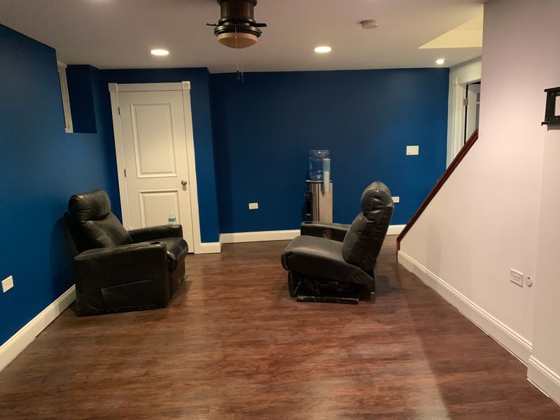 Basement painted deep blue with white trim