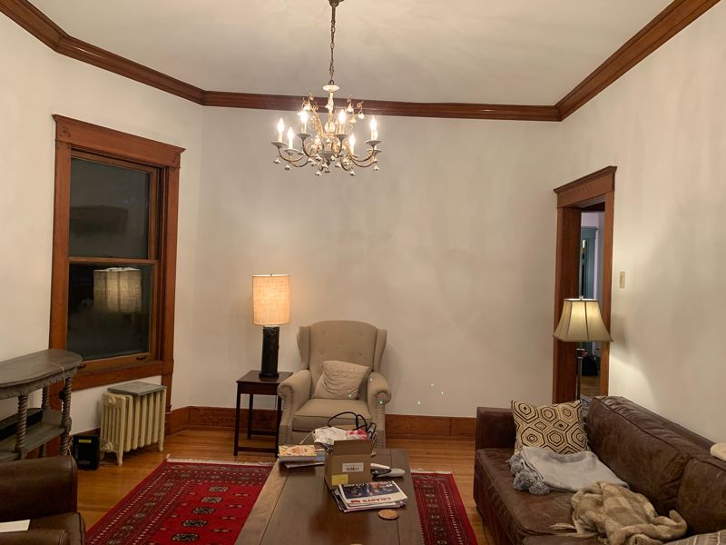 Living room walls painted, wood trim kept