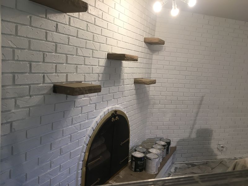White painted brick fireplace wall