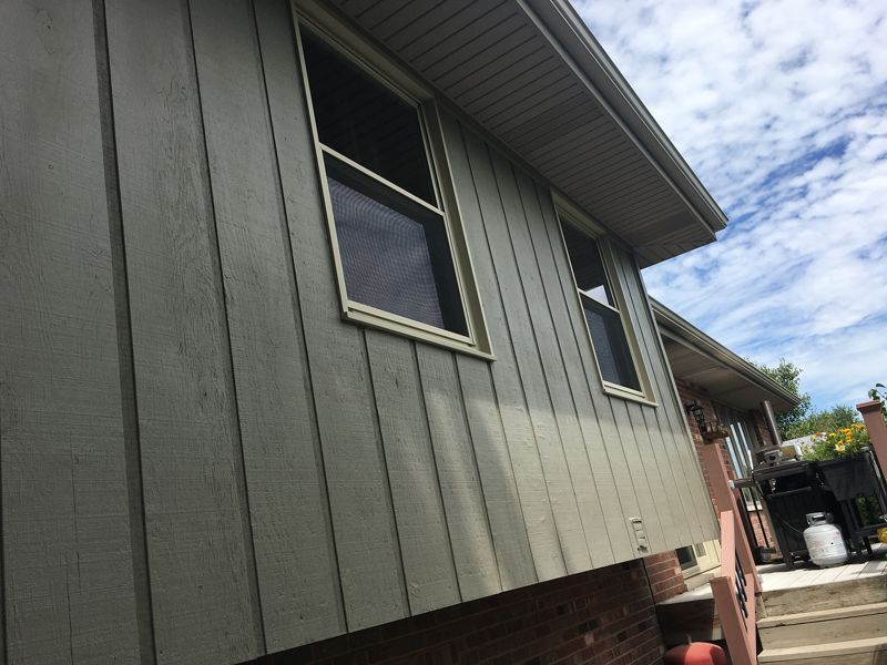 Green board-and-batten siding