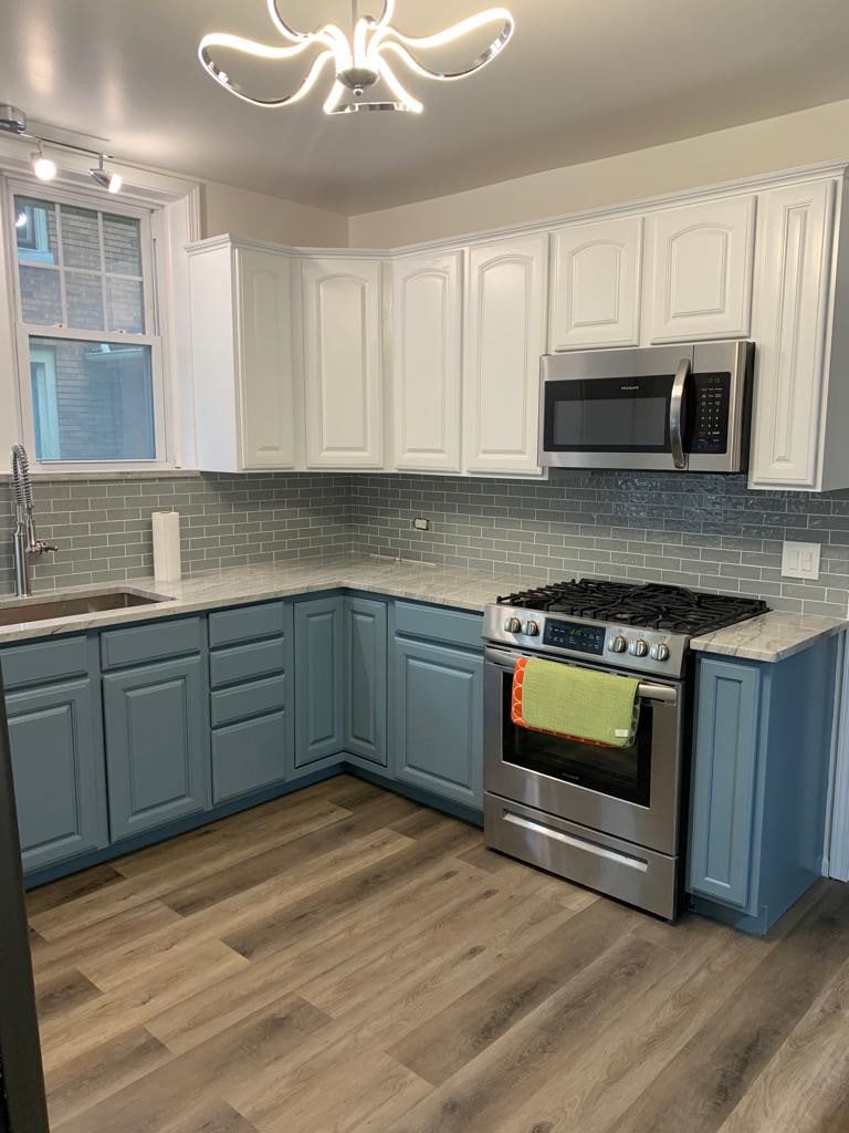 Two-tone kitchen: white uppers, blue-gray lowers